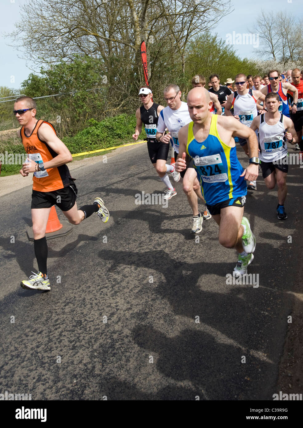 start of black dog running club marathon Stock Photo