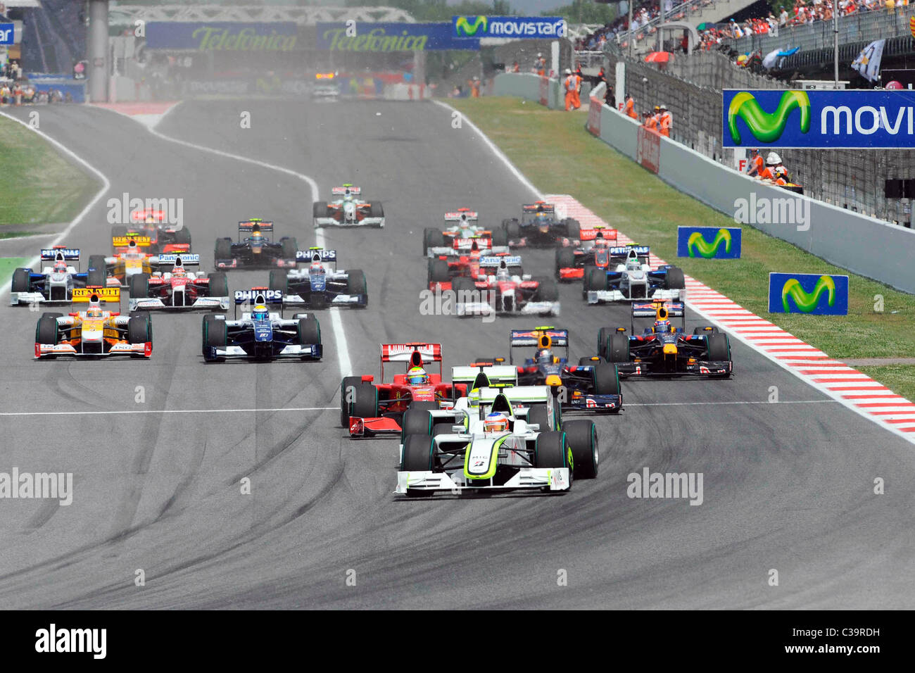 Jenson Button racing in his Brawn GP in pole position at the start of ...