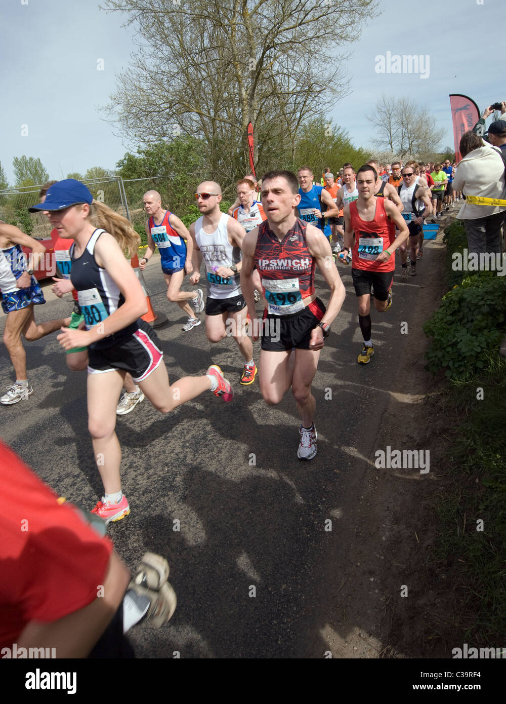 black dog running club marathon Stock Photo