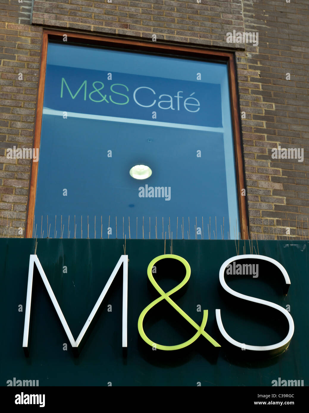 The M&S logo over the entrance to Worthing Marks and Spencer Stock Photo