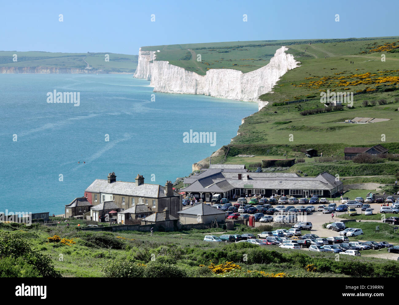 Birling Gap, between the Seven Sisters cliffs (background) and Beachy Head, East Sussex. Part of the South Downs National Park. Stock Photo
