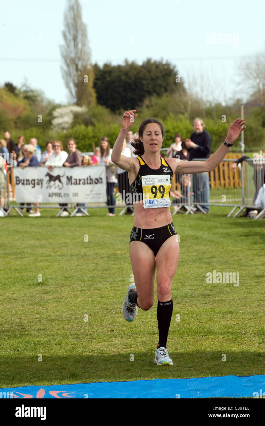 woman finishing running bungay black dog marathon Stock Photo