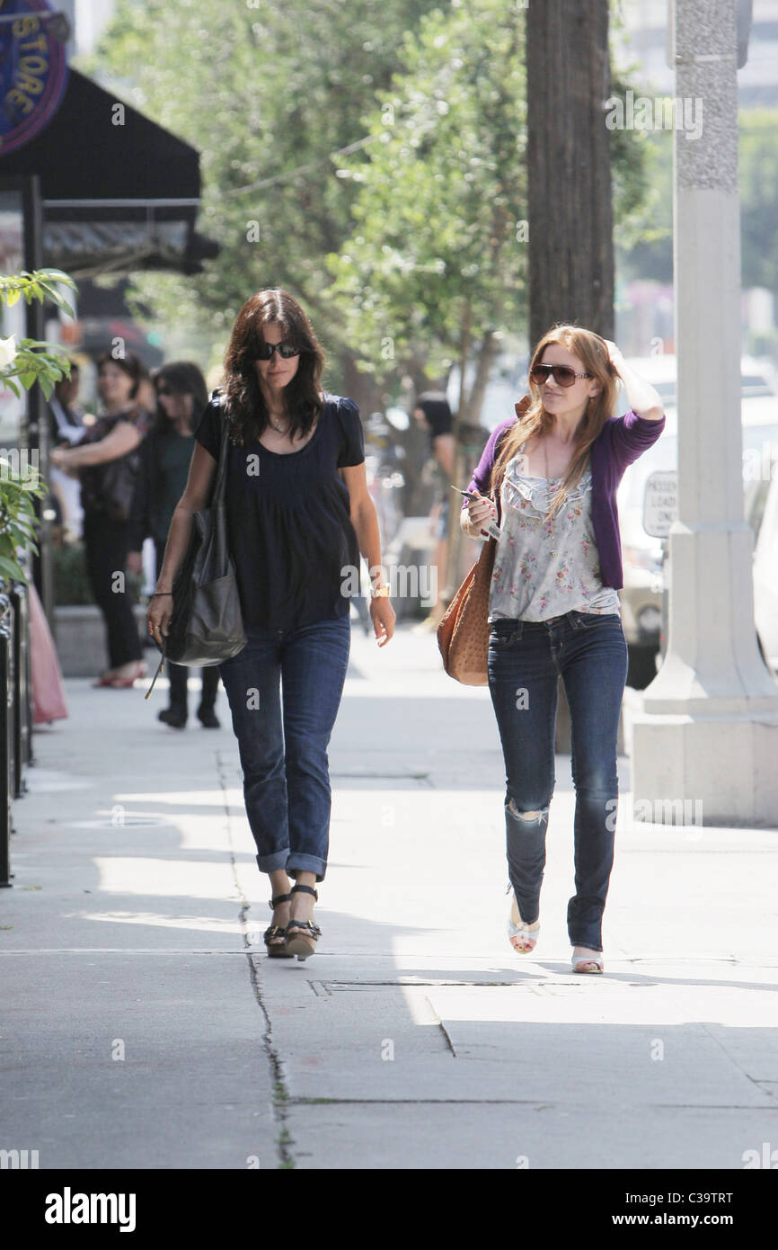 Courteney Cox and Isla Fisher share a few laughs while leaving Joans On  Third after having lunch together Los Angeles Stock Photo - Alamy