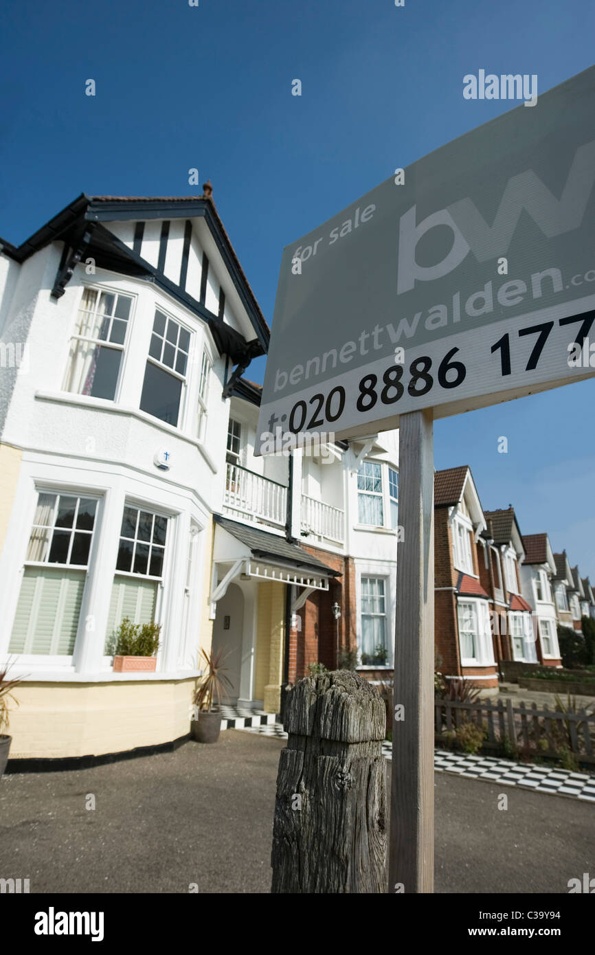 'For Sale' sign in front of a house in north London Stock Photo