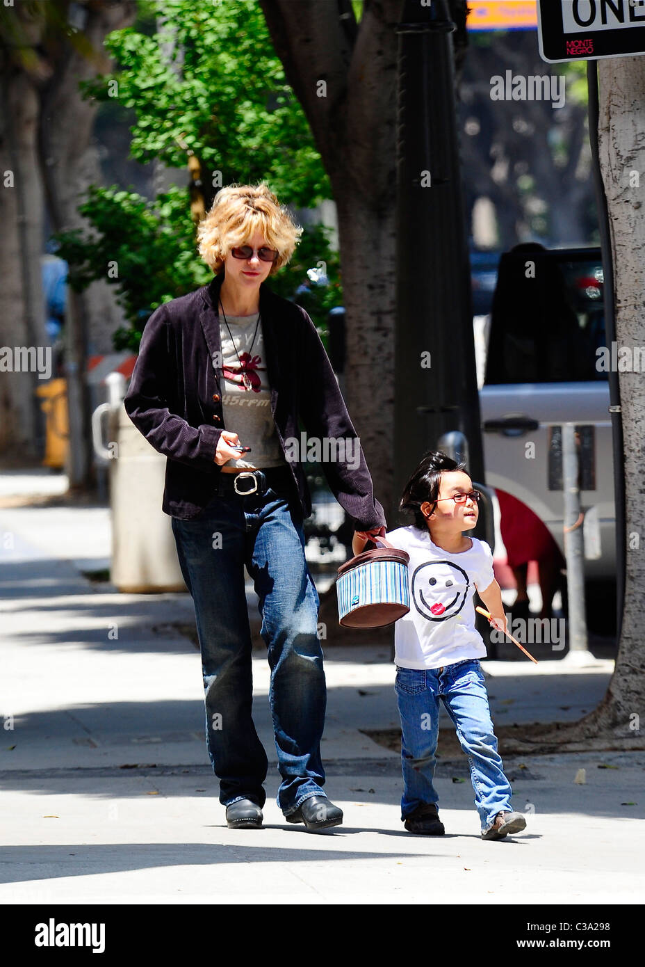 Meg Ryan picks up her adopted daughter, Daisy, from school in Santa