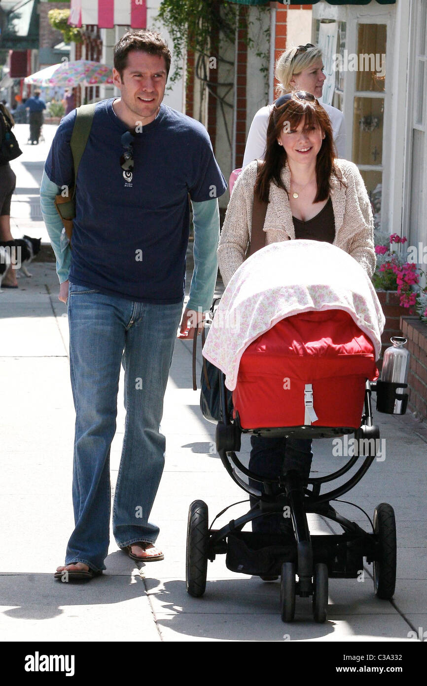 Alyson Hannigan pushing her seven week old baby, Satyana, in a stroller  while out shopping with her husband, Alexis Denisof, on Stock Photo - Alamy