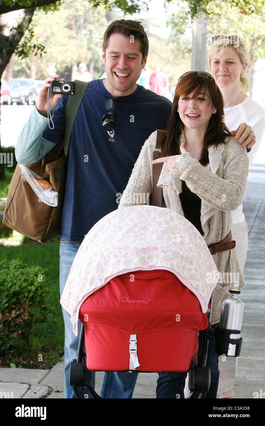 Alyson Hannigan pushing her seven week old baby, Satyana, in a stroller  while out shopping with her husband, Alexis Denisof, on Stock Photo - Alamy