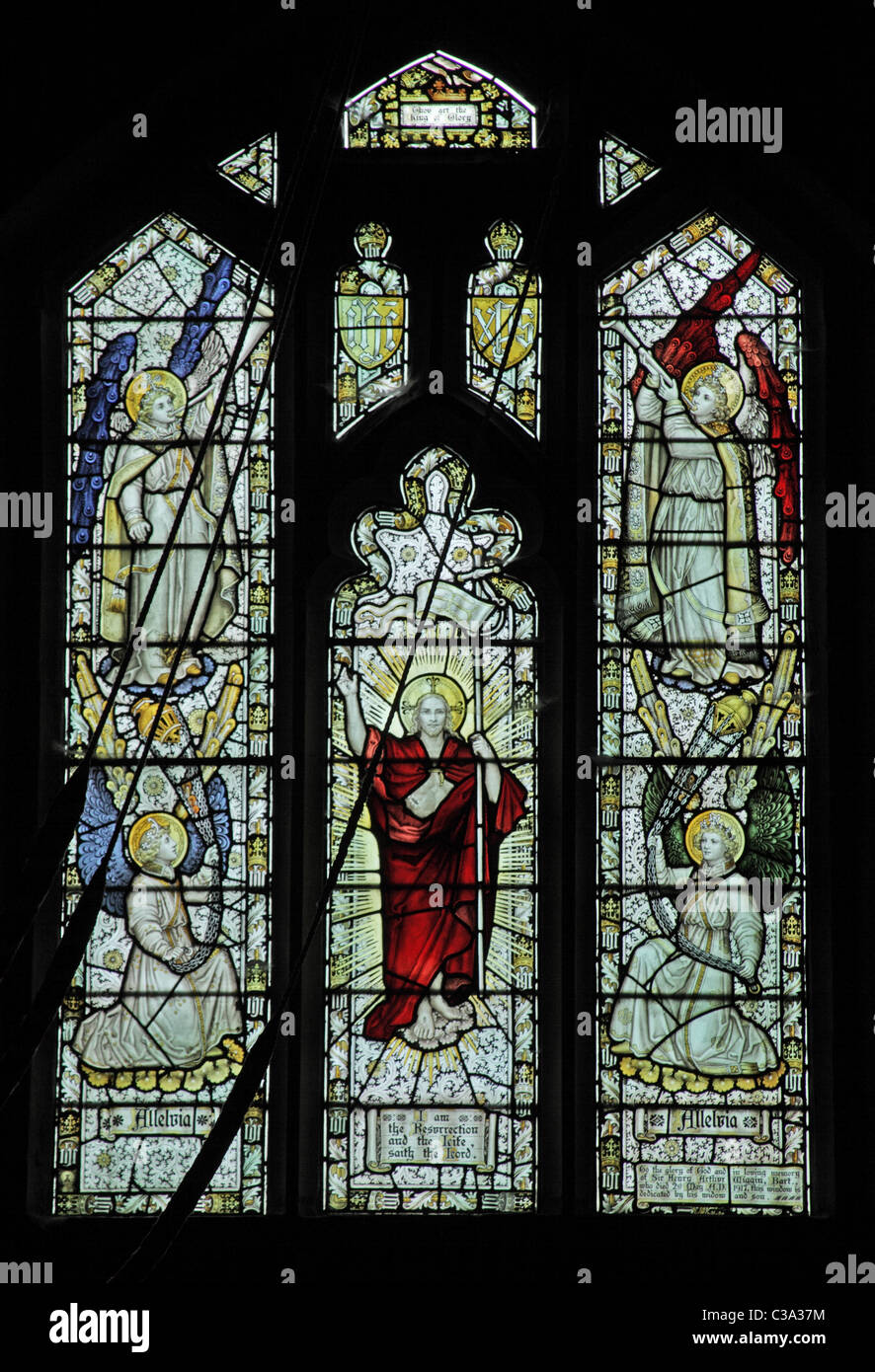 A stained glass window by C E Kempe & Co. depicting the Risen Christ and angels, All Saints Church, Chebsey, Staffordshire Stock Photo