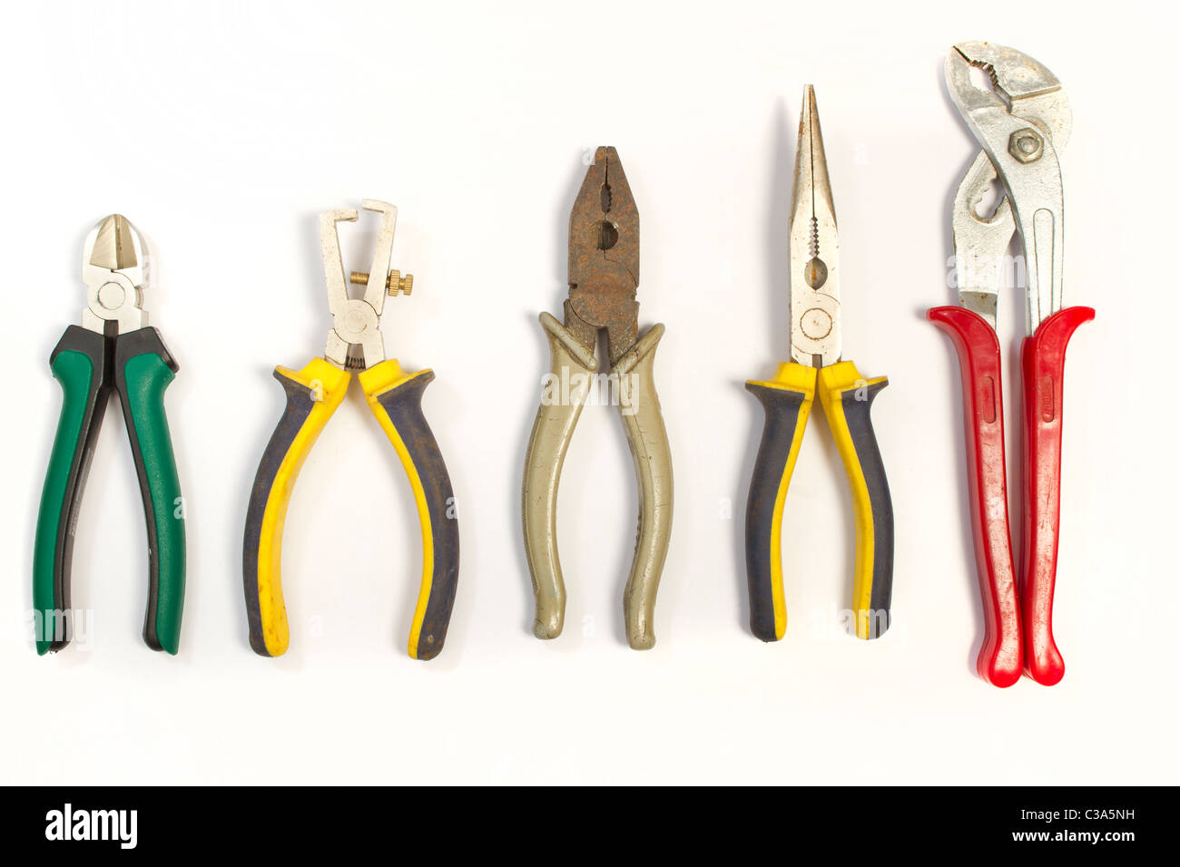 Set of several different used pliers for electrical works Stock Photo