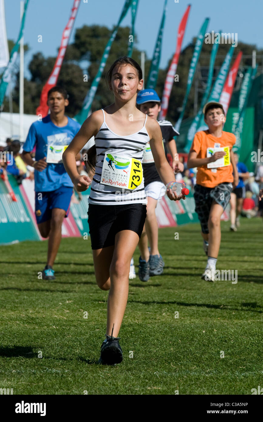 Girl finishing the 5km Fun Run, Two Oceans Marathon, Cape Town, South Africa Stock Photo