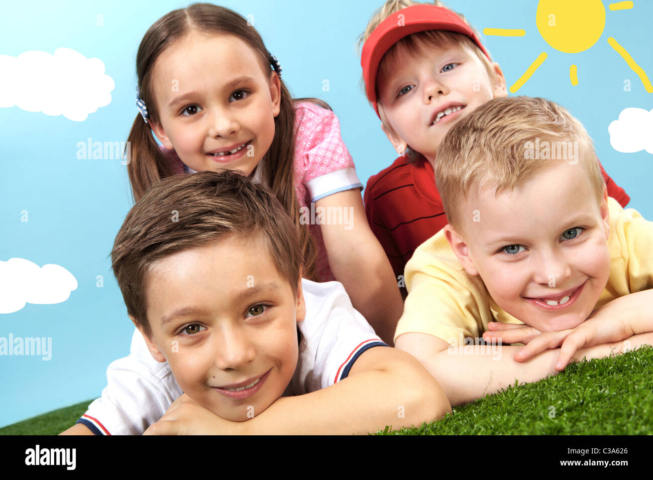 Schoolboy lying on grass hi-res stock photography and images - Alamy