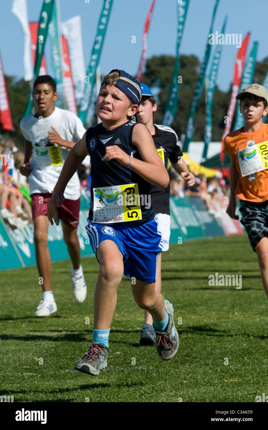 Boy finishing the 5km Fun Run, Two Oceans Marathon, Cape Town, South Africa Stock Photo