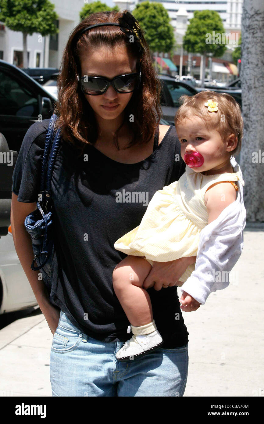 Jessica Alba carries her daughter, Honor Marie Warren, as they leave