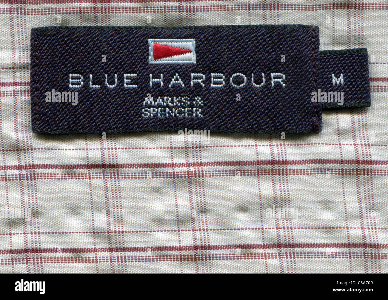Detail of the label in the collar of a man's shirt from the clothing Blue harbor - TM of Marks and Spenser Stock Photo