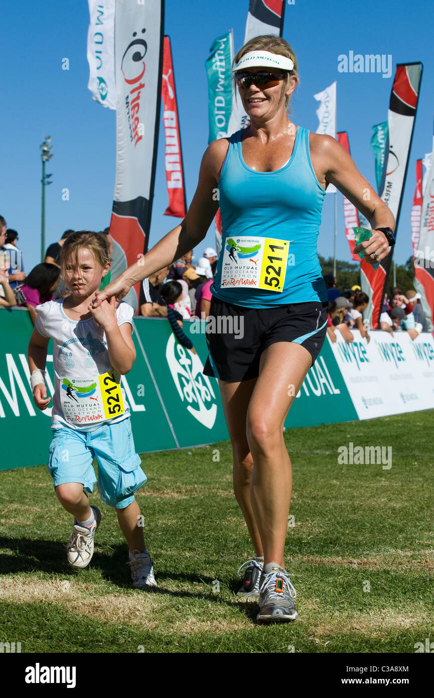 Mother and daughter finish the 5km Fun Run, Two Oceans Marathon, Cape Town, South Africa Stock Photo