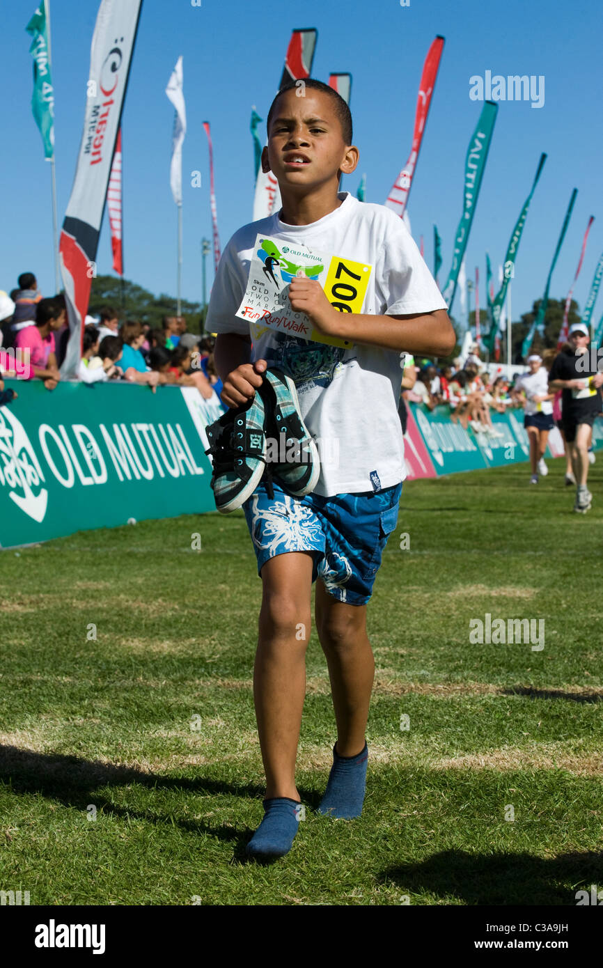 Teenager finishing the 5km Fun Run, Two Oceans Marathon, Cape Town, South Africa Stock Photo