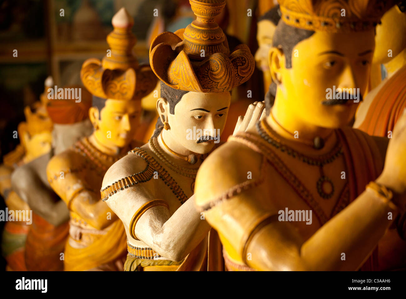 statues of Buddha and worshippers at Wewurukannala Vihara Temple near Dikwella, Pussalagoda, Sri Lanka, Walasgala Stock Photo