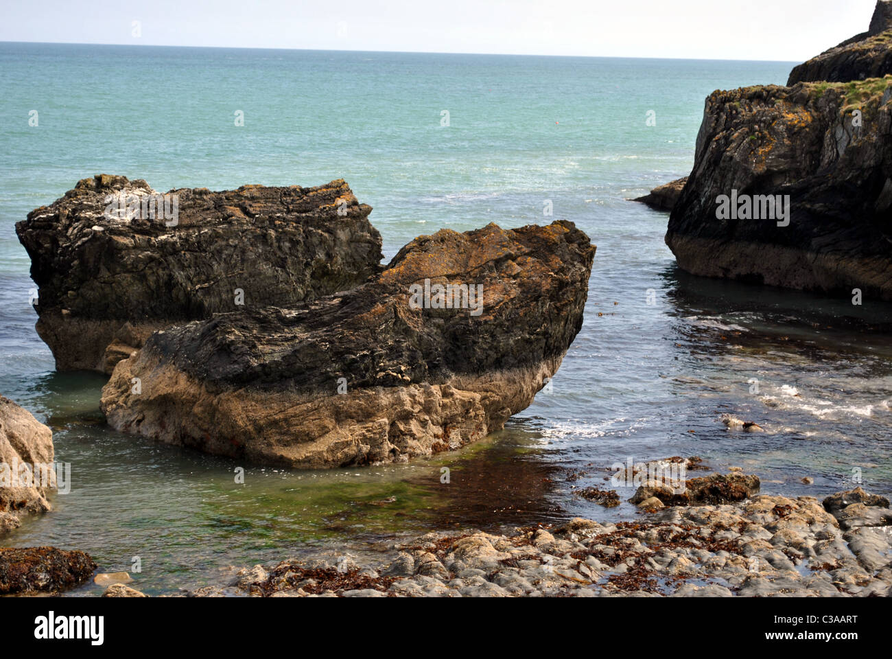 rock formations in the irish sea at wicklow ireland Stock Photo
