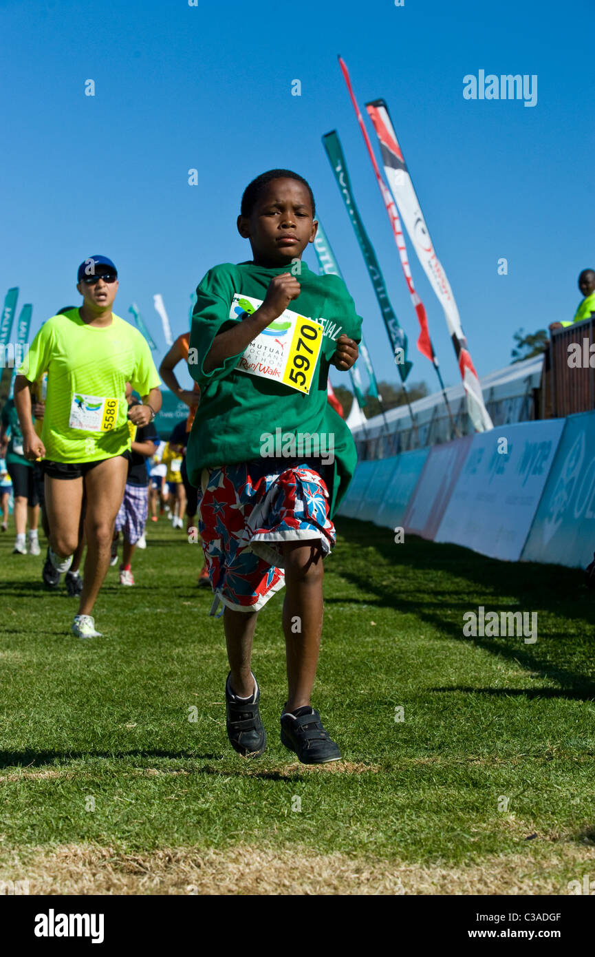 Teenager finishes the 5km Fun Run, Two Oceans Marathon, Cape Town, South Africa Stock Photo