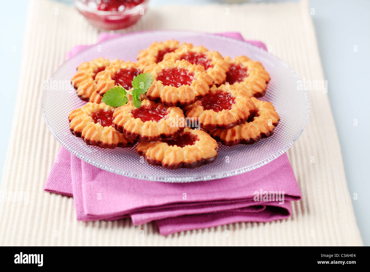 Chocolate dipped butter cookies with jelly center Stock Photo Alamy