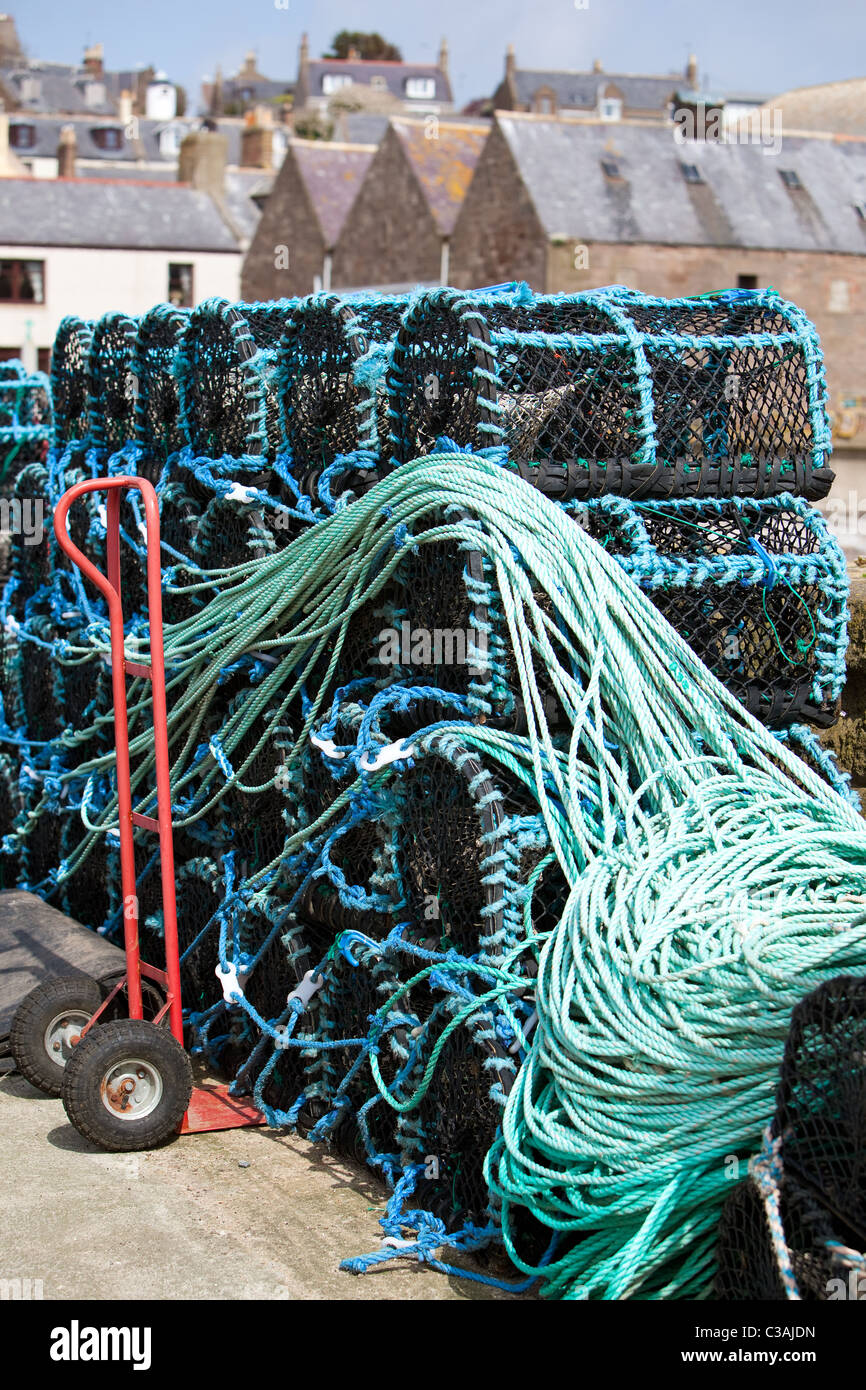 Stacked Creels ready for fishing. Gourdon harbour. Scotland Stock Photo