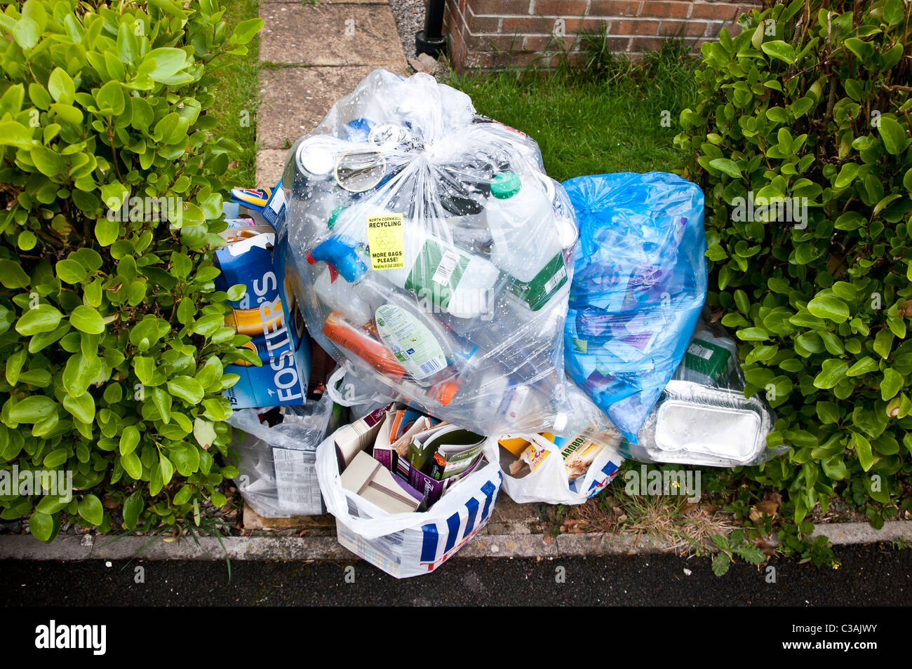 Recyclable household waste put out for kerbside collection. Householders sort the waste into eg