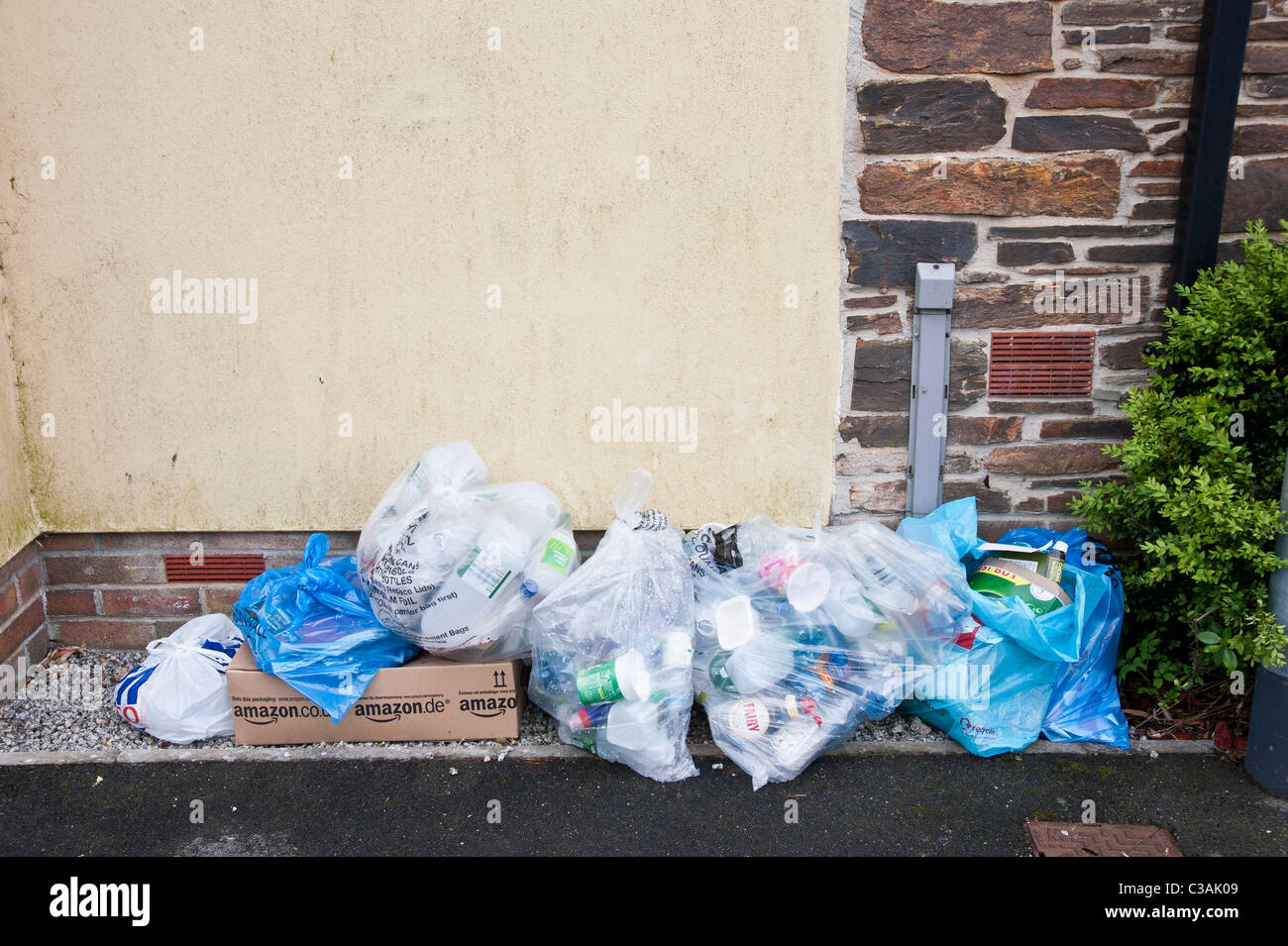 Recyclable household waste put out for kerbside collection. Householders sort the waste into eg