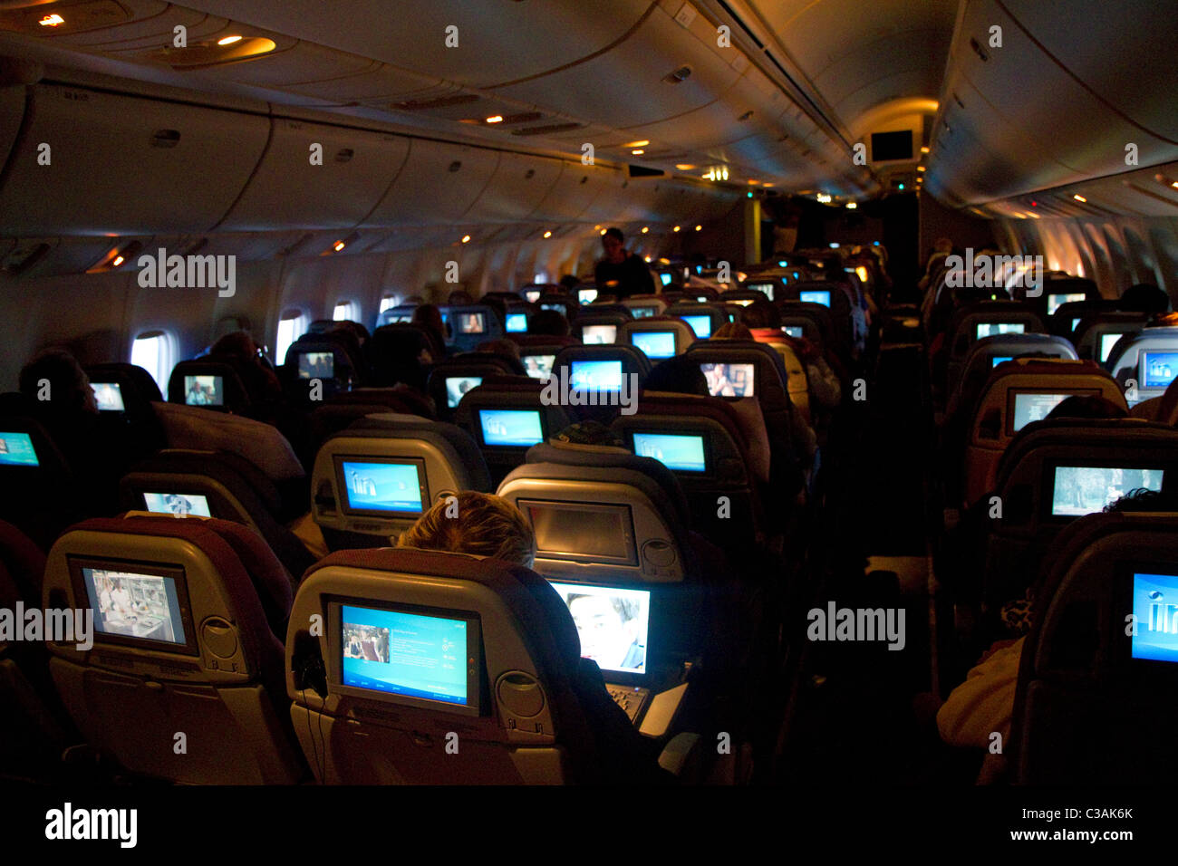 Interior of a Boeing 767 aircraft coach class cabin. Stock Photo