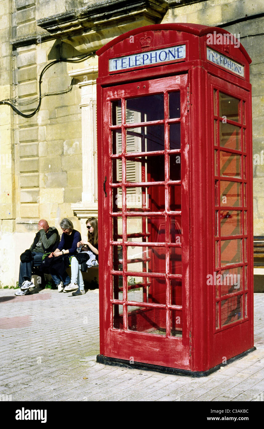 Red phone booth in Xewkija on the Maltese island of Gozo. Stock Photo
