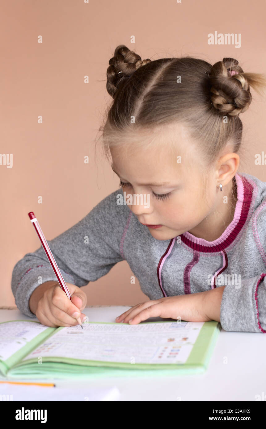 Hand of the girl with a pencil Stock Photo - Alamy