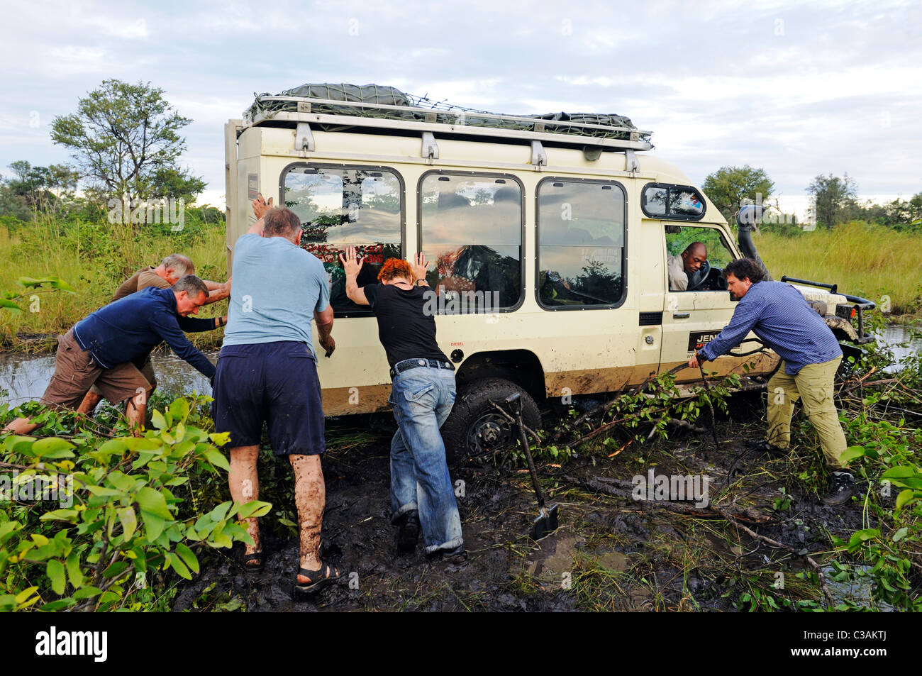 Tourists with a stuck Four wheel Drive in the mud, Caprivi Strip