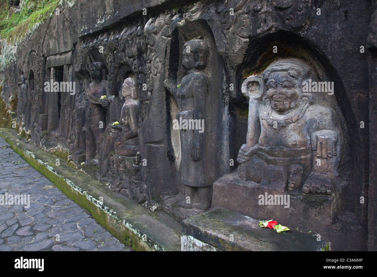 This stone bas relief is the Hindu Shrine of YEH PULU dating back to the 14th century - PUTULU, BALI Stock Photo