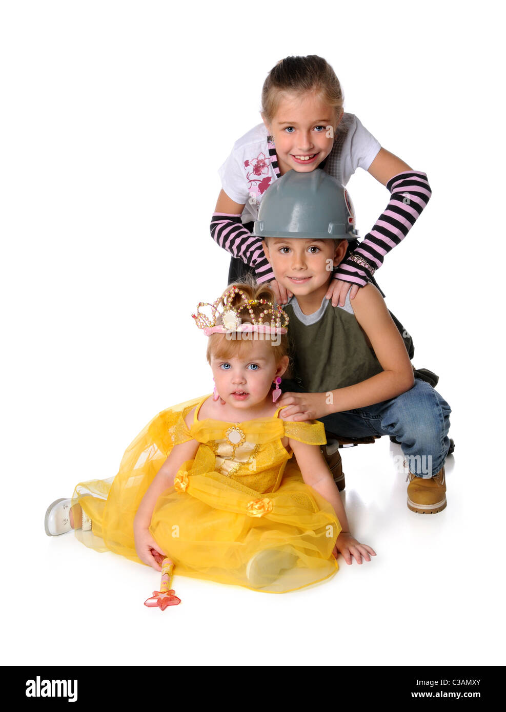 Young children dressed in costumes isolated over white background Stock Photo