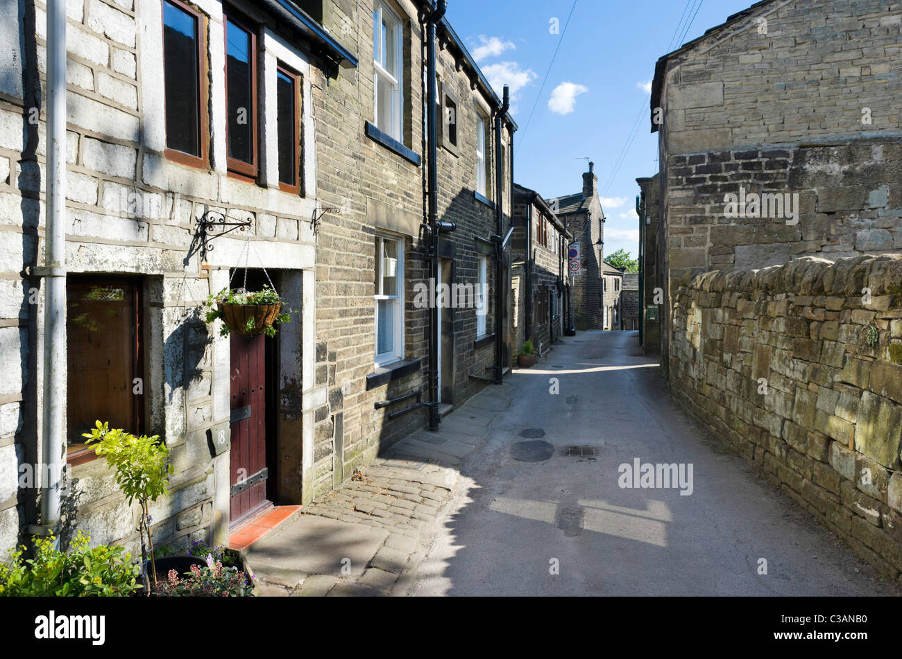 Traditional stone houses along the main street in Heptonstall, near Hebden Bridge, West Yorkshire, UK Stock Photo