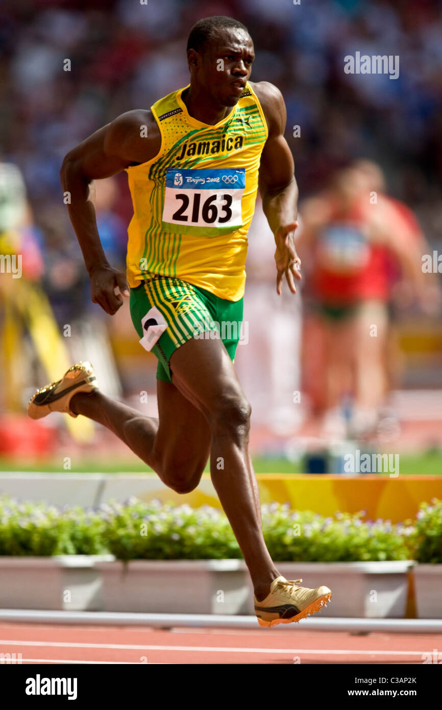 Usain Bolt (JAM) competing in the first round of the 100m at the 2008 ...