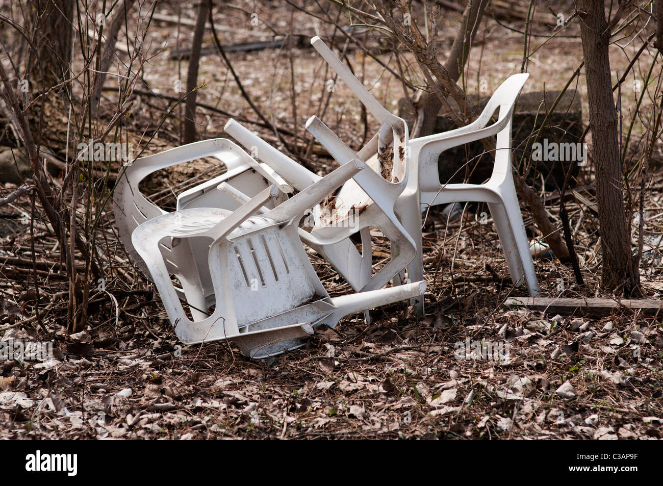 Discarded plastic chairs. Stock Photo