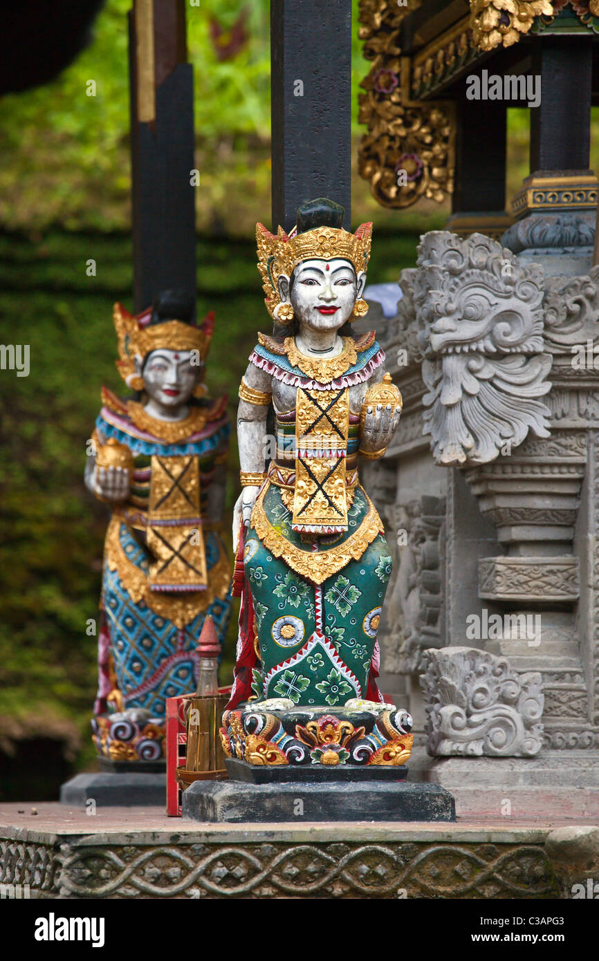 Wood carved deity struts at PURA GUNUNG KAWI, a Hindu water temple dedicated to VISHNU - SEBATU, BALI, INDONESIA Stock Photo