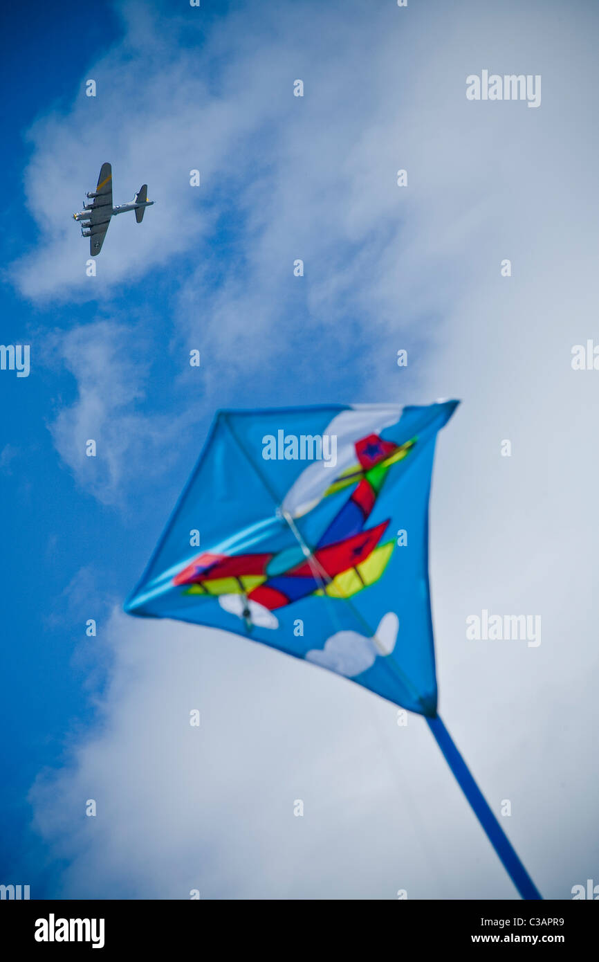 kite flying under wwii bomber Stock Photo