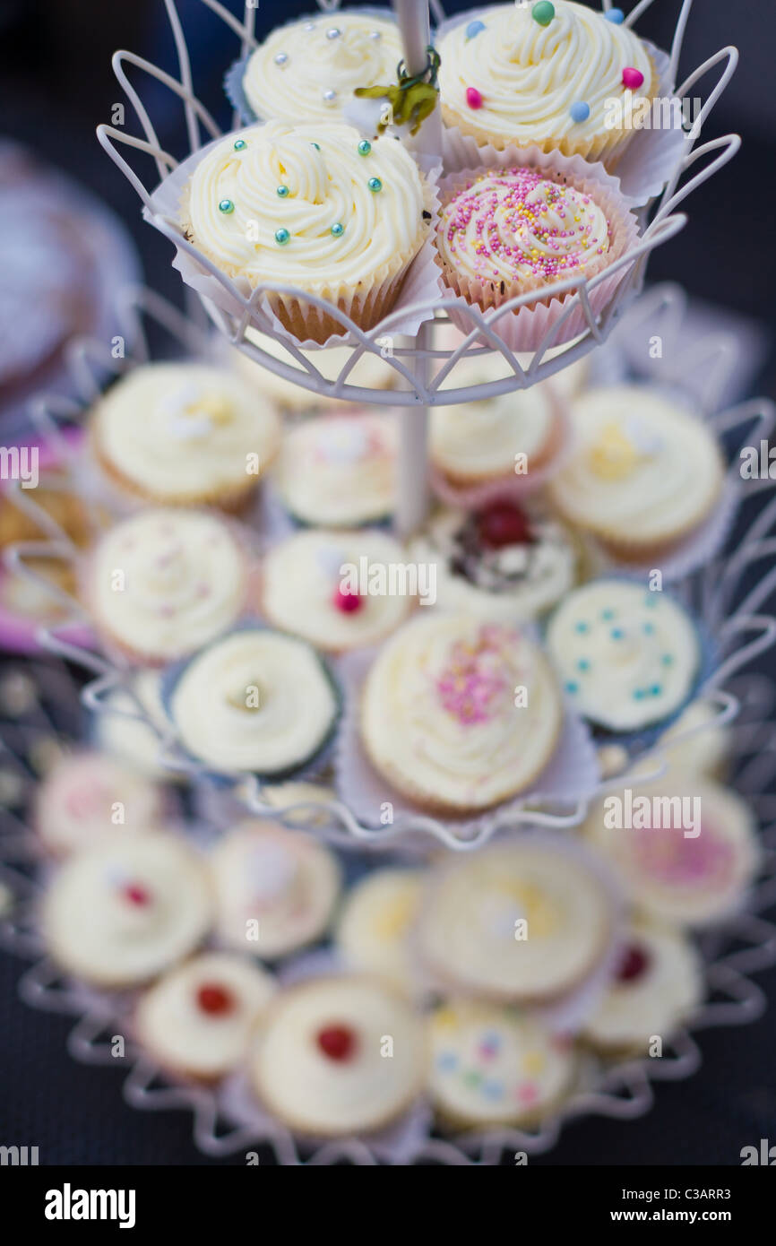 A selection of fairy cakes on a stand Stock Photo