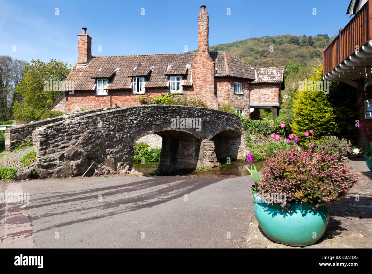 The ancient pack horse bridge over the River Aller at Allerford Exmoor Somerset Stock Photo Alamy