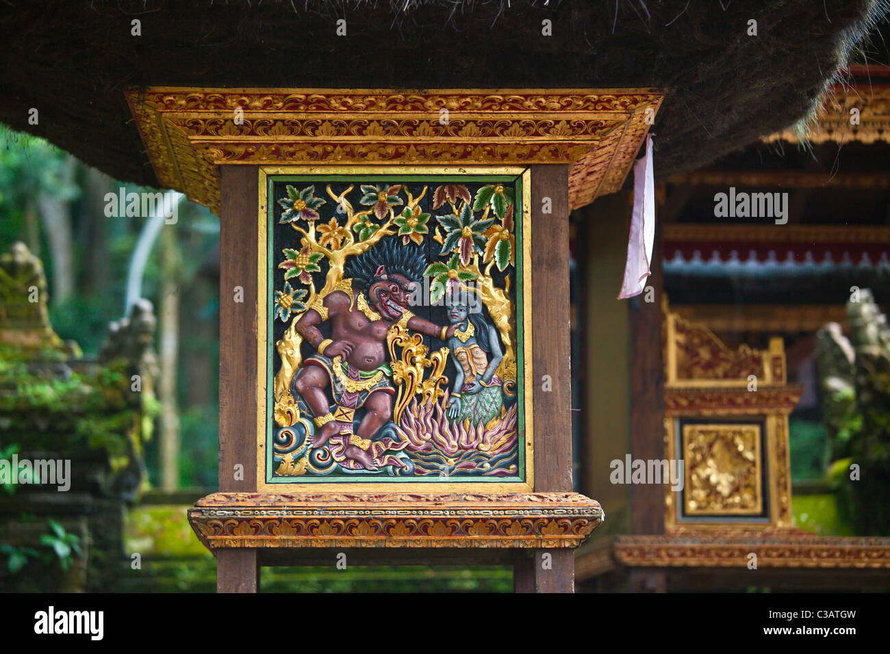 A mythological bas relief at the Hindu temple PURA NAGA SARI is found in THE MONKEY FOREST PARK - UBUD, BALI, INDONESIA Stock Photo