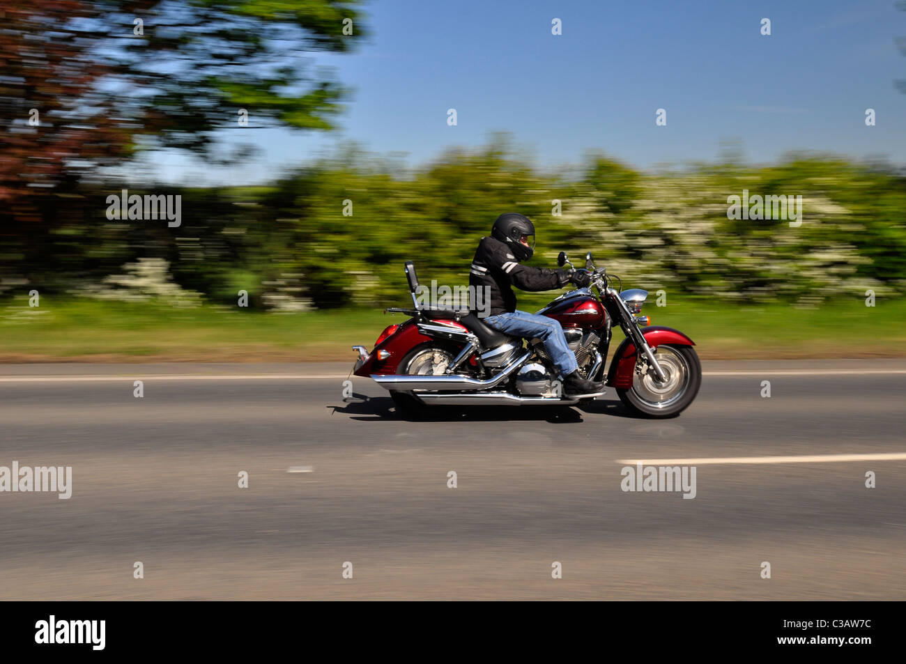 Harley Davidson Motorcycle and Rider with motion blur Stock Photo