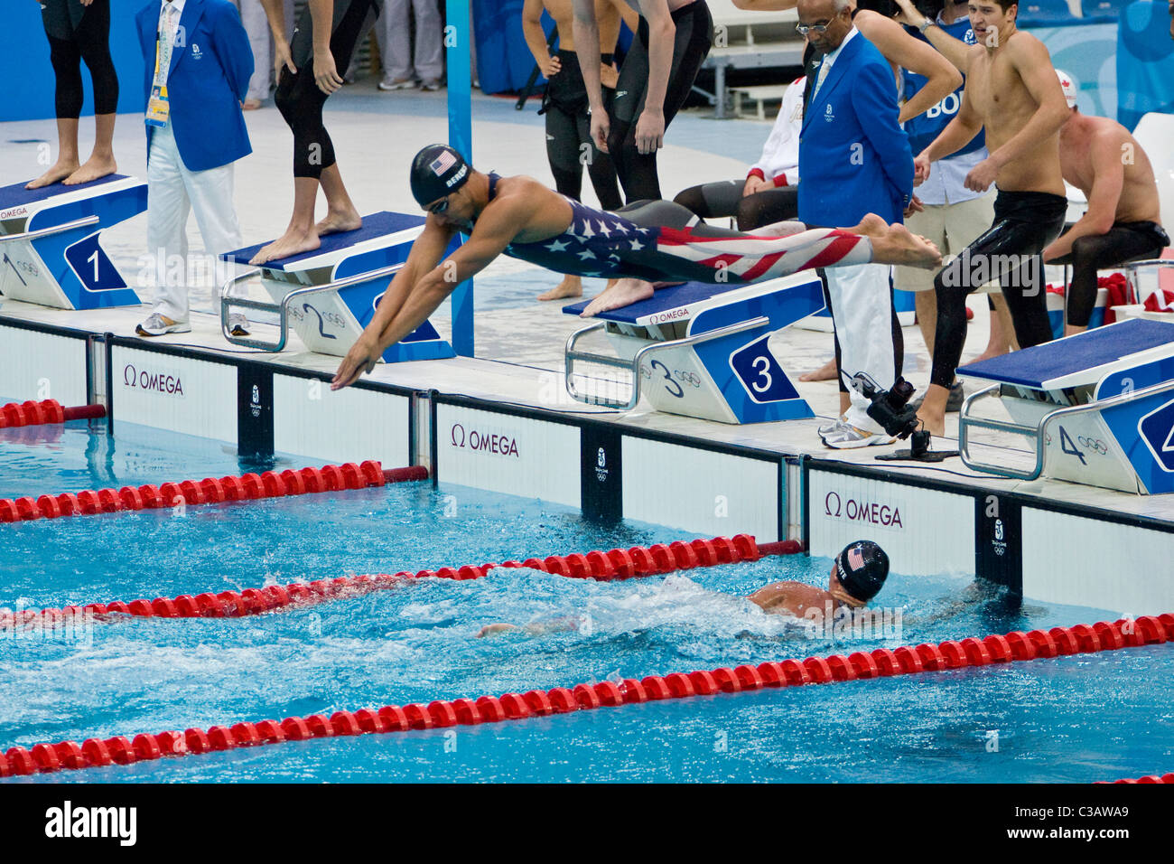 Ryan Lochte touches the wall as Ricky Berens start the third leg of the ...