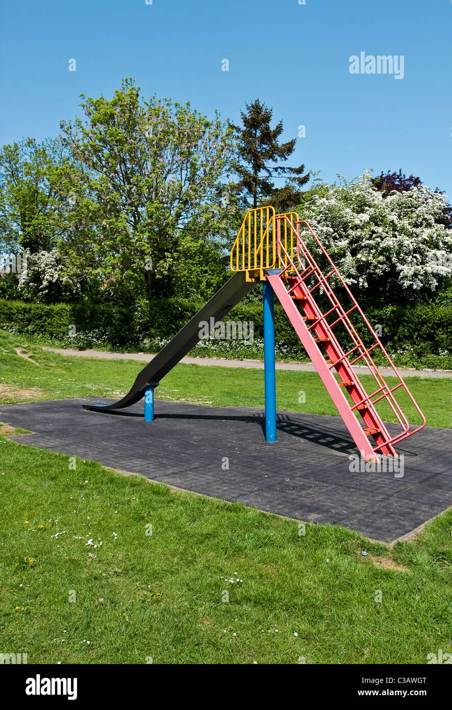 Slide in a playground in Doddinghurst, Essex Stock Photo