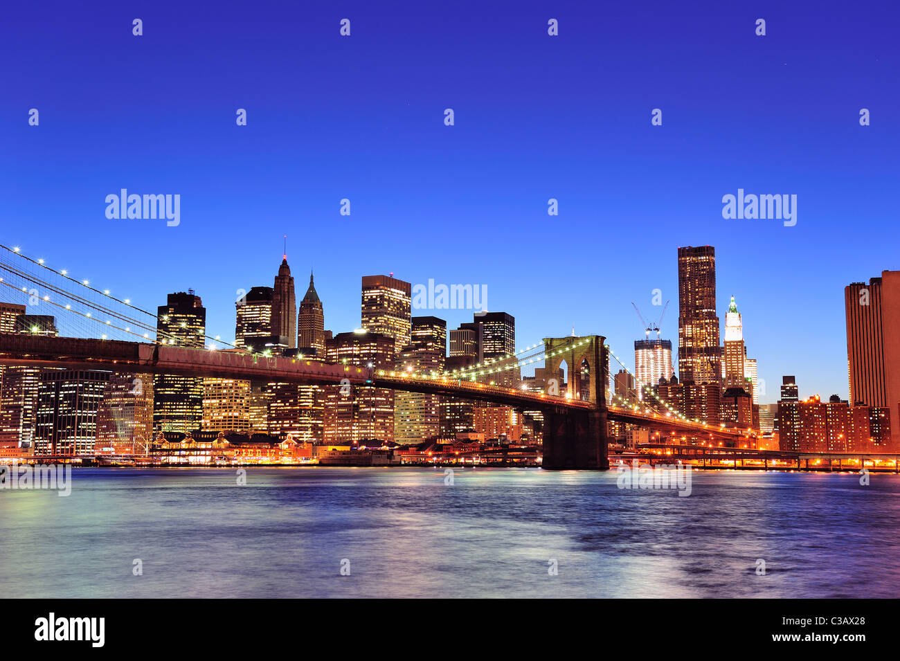 Brooklyn bridge with New York City Manhattan downtown skyline at dusk ...
