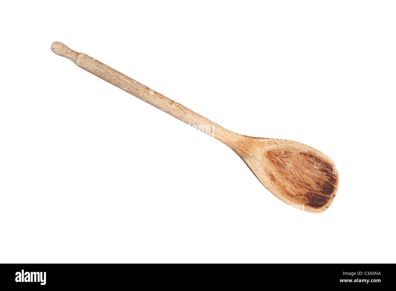 An old wooden cooking spoon isolated on white Stock Photo