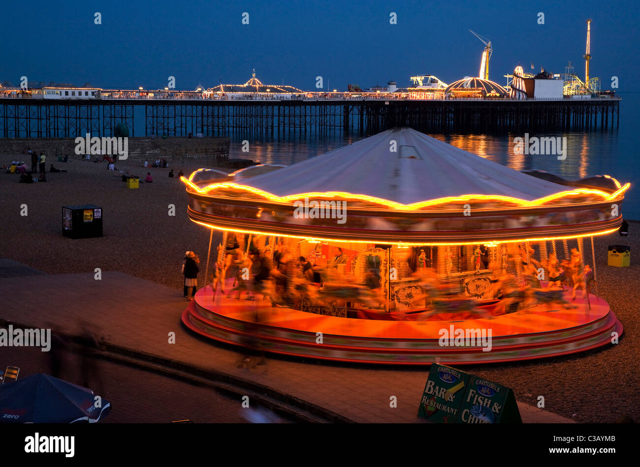 A moving carousel on Brighton beach at night Stock Photo Alamy