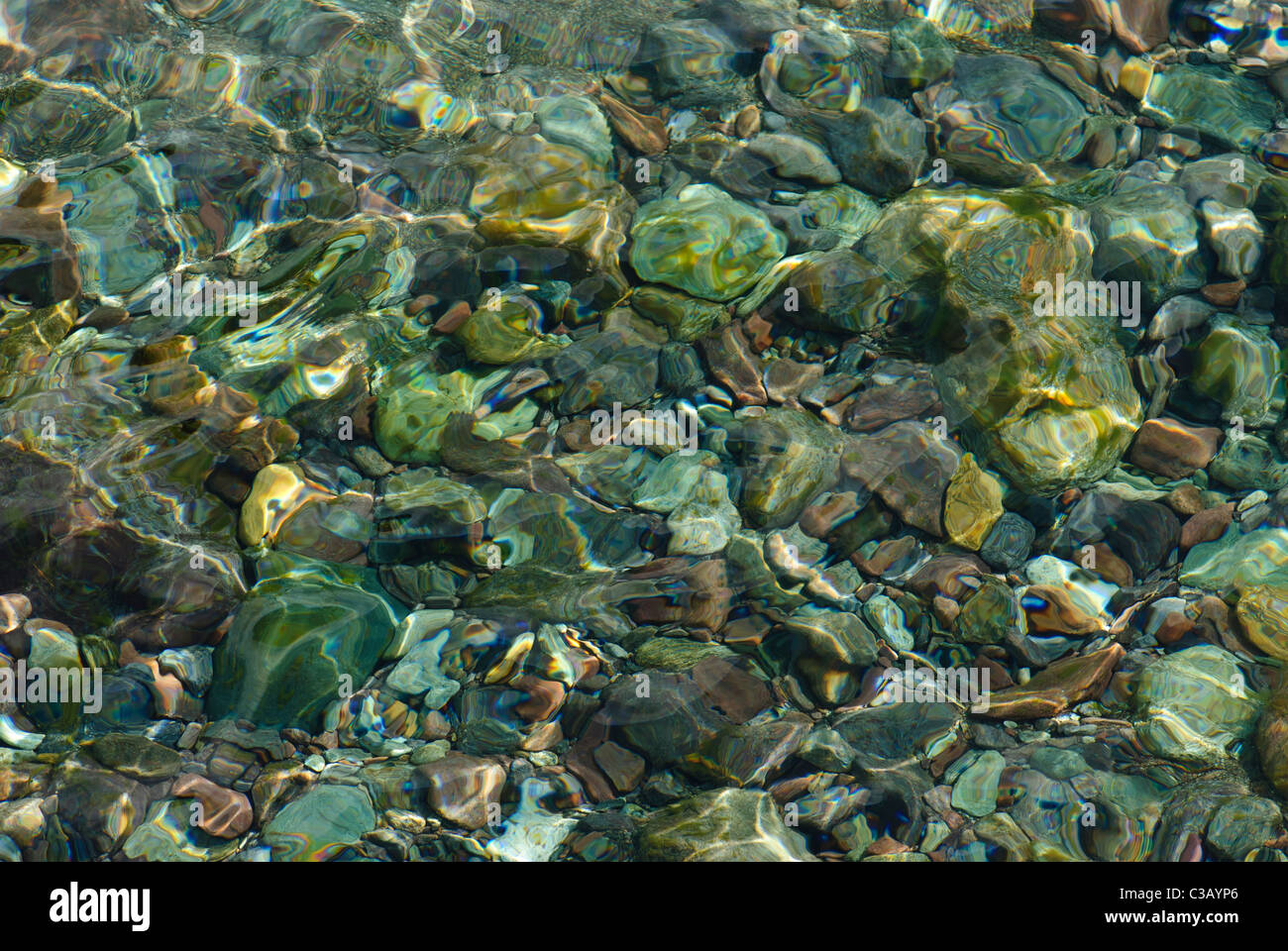 Clear water in a mountain brook with stones and rocks, Corsica, France Stock Photo
