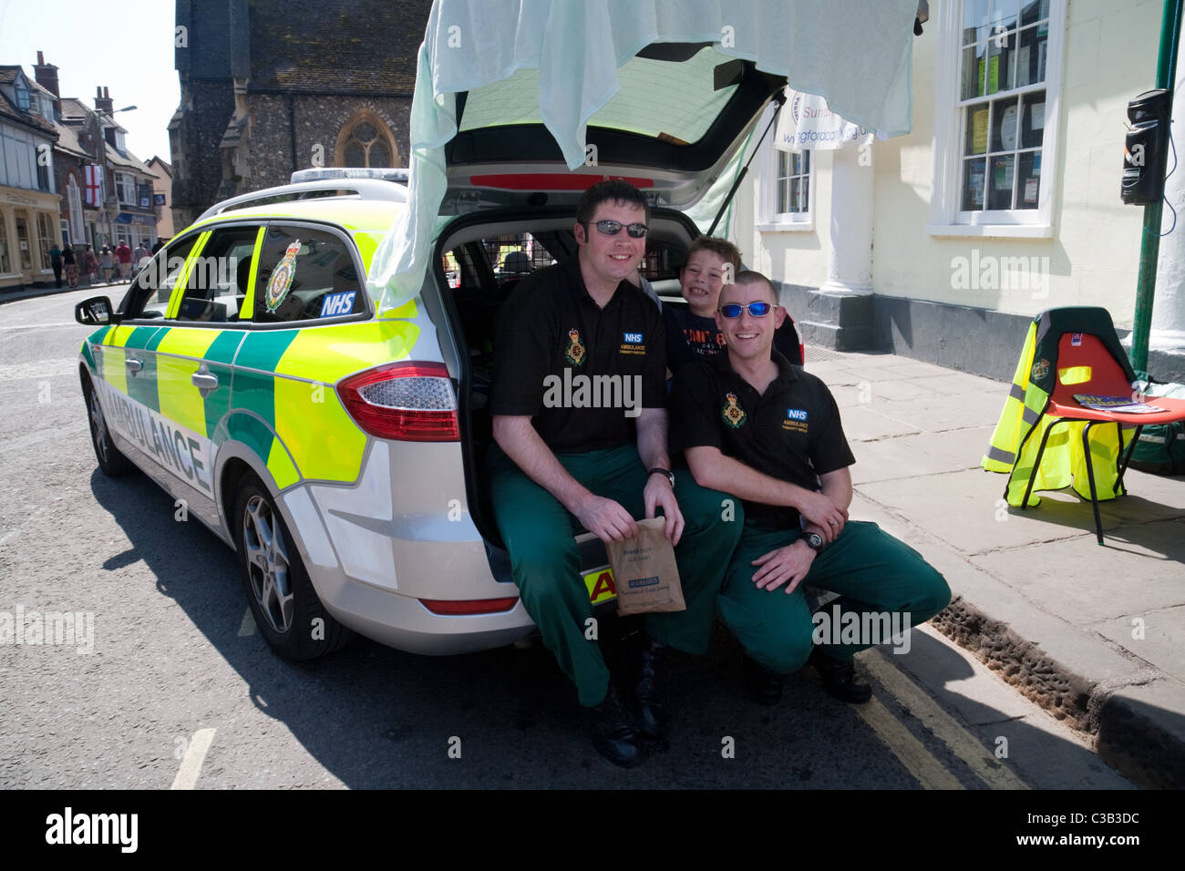 Paramedics in their car on duty at the town fair, Wallingford, Oxfordshire UK Stock Photo