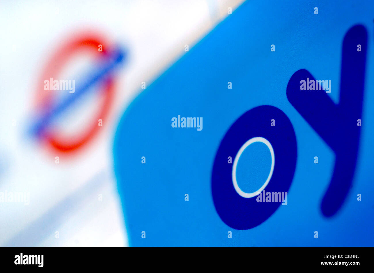 An Oyster Travel Card and a map of the underground network Stock Photo